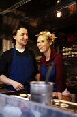 A sales couple in a mobile food unit