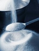 Sugar being poured onto a spoon