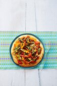 Vegetable pizza with peppers and pesto