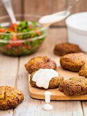 Falafel with a yoghurt and tahini sauce served with parsley salad