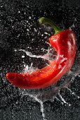 A red pepper falling into water