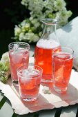 Refreshing Aperol drinks in glasses and a carafe