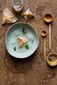 Ginger and apple wontons in coconut water