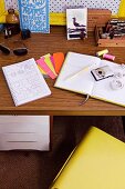 Writing utensils, camera and vintage ornaments on 70s desk