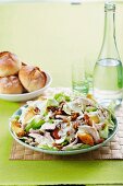 Iceberg salad with chicken breast, roasted apples and walnuts