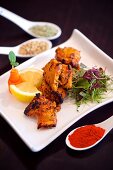 Marinated, grilled chicken with spices and lemons