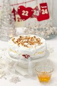 Pavlova with vanilla cream and nuts