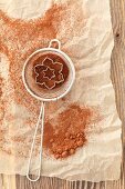 Cocoa powder in a sieve with cutters