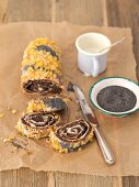 Poppyseed and the yeast roulade with icing and orange zest