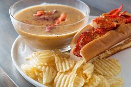 Lobster soup with a lobster roll and potato crisps