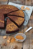 Chocolate cake with gingerbread on a wire rack