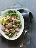 A green salad with poached salmon