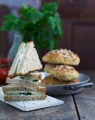Cucumber sandwiches and wholemeal rolls