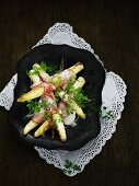 Fried white asparagus wrapped in bacon