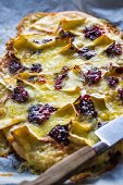 Pizza with brie, mozzarella and cranberries