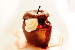 A baked apple filled with wild cherries