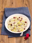 Sauerkraut salad with leeks, apples and dried cranberries