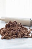 Chocolate dough for cookies with a rolling pin