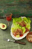 Sweet and spicy soja medallions on a bed of lettuce