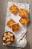 Almond slices, sugar and almonds on a doily