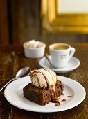 A brownie with vanilla ice cream and espresso in a pub