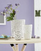 DIY knitted vases - vases with knitted covers on side table