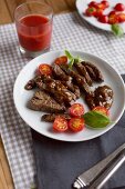 Beef fillet with peanut sauce and cherry tomatoes
