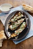 Oven-roasted aubergines with sesame seeds, honey and mint yoghurt (Arabia)