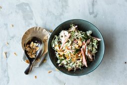 Brussels sprouts and carrot salad with flaked almonds