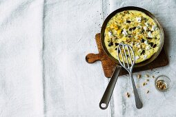 Courgette omelette with black olives