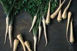 Fresh parsnips on a wooden surface