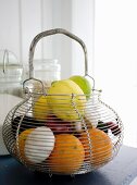 Wire basket of fresh fruit and vegetables
