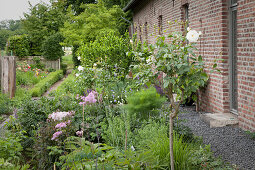 Landscaped garden outside brick house