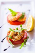 Prawns on tomato slices as a party snack