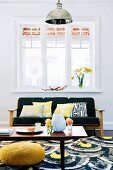 Retro-style living area with black and yellow colour scheme and white lattice windows