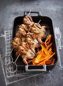 Quails with garlic and tarragon butter with glazed carrots