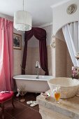 Vintage bathtub in renovated bathroom with antique, elegant ambiance