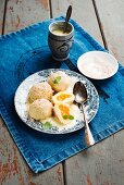 Sweet dumplings with yellow plum jam