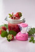 Strawberry and wild strawberry jam in a preserving jar