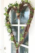 Hand-crafted, heart-shaped wreath made from birch twigs and ivy