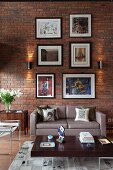 Gallery of pictures on brick wall of loft apartment living room with retro furniture