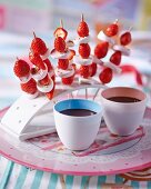 Strawberry and marshmallow skewers with a chocolate dip