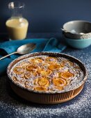 Calfoutis with apricots and icing sugar
