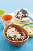 Chocolate rice pudding with almond flakes