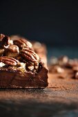 Dark chocolate terrine with pecan nut brittle (close-up)