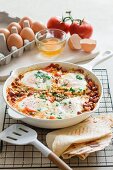 Tomato and bean stew with chorizo and fried eggs