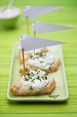 Herb quark on bread decorated with small paper flags