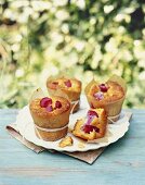 Plum muffins on a garden table