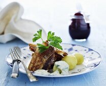 Fried fish steaks with new potatoes and herb mayonnaise