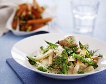 Fried chicken breast with mustard sauce, dill, carrots and fresh asparagus